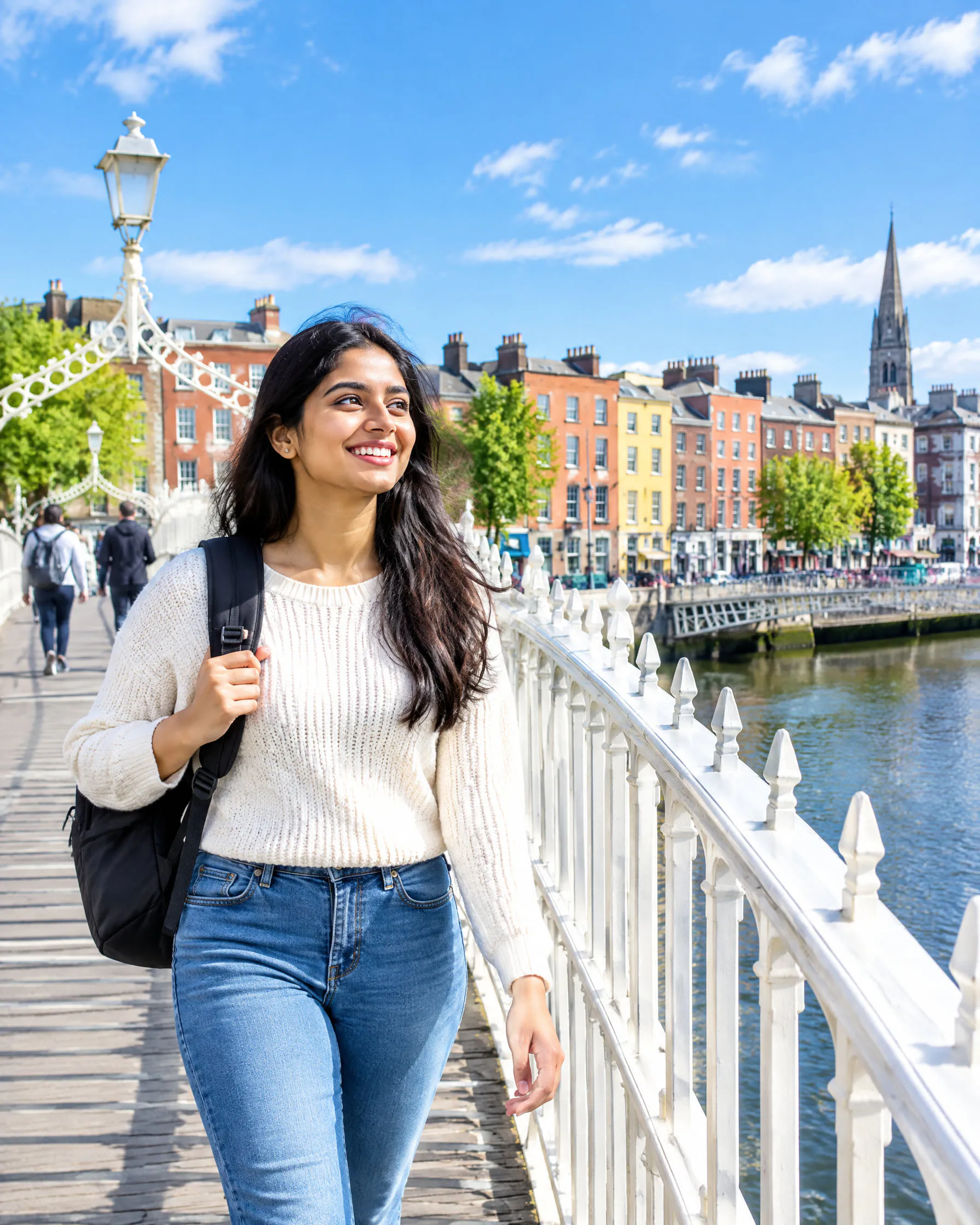 A student crossing the Ha’penny Bridge over the River Liffey in Dublin